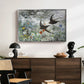 Common Swifts, 1886 by Bruno Liljefors displayed in a silver floater framed canvas above a dark wood credenza in an entryway.