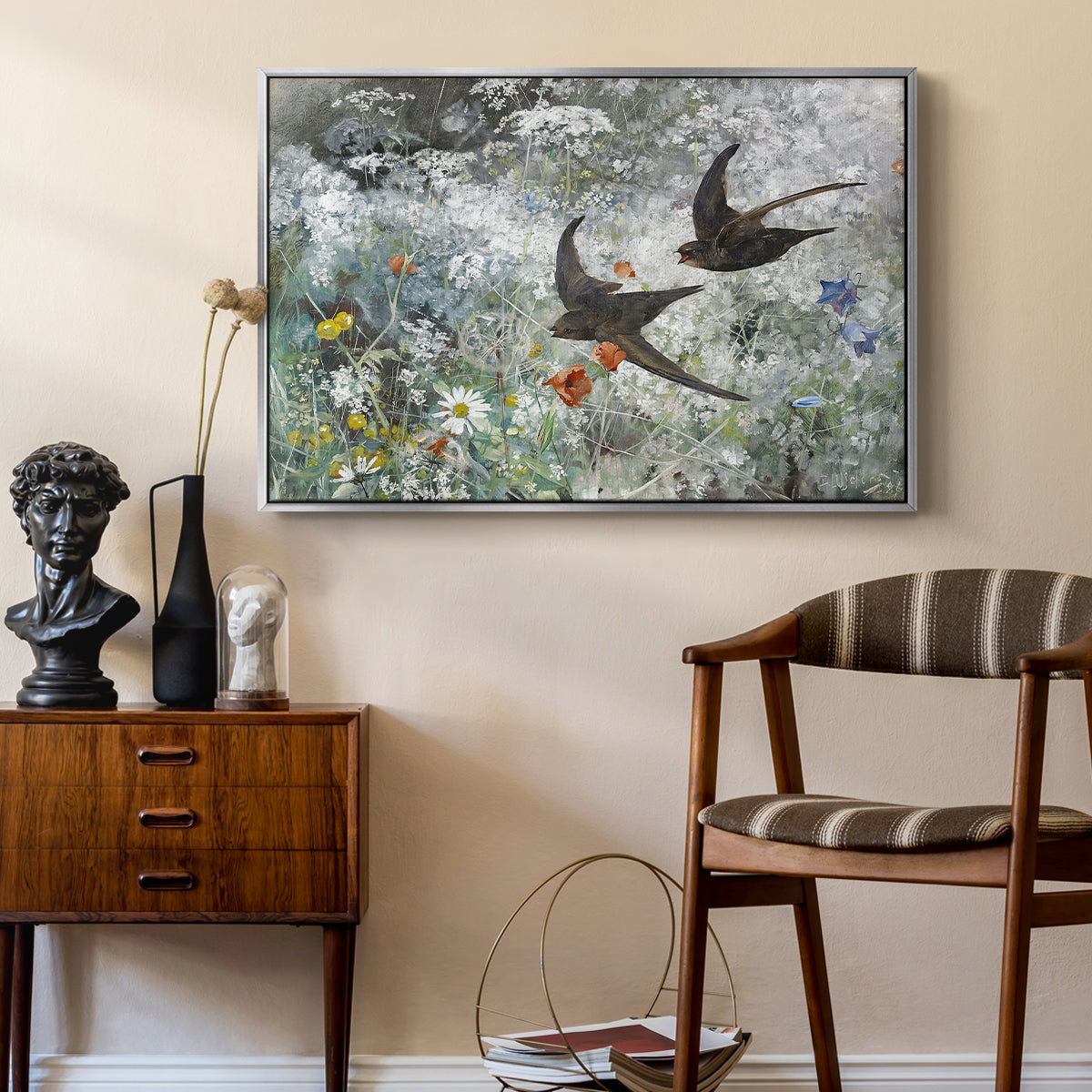 Common Swifts, 1886 by Bruno Liljefors as a silver floater framed canvas featuring a multiple birds flying together in natural outdoor scene, styled above a mid-century console in a contemporary living area.