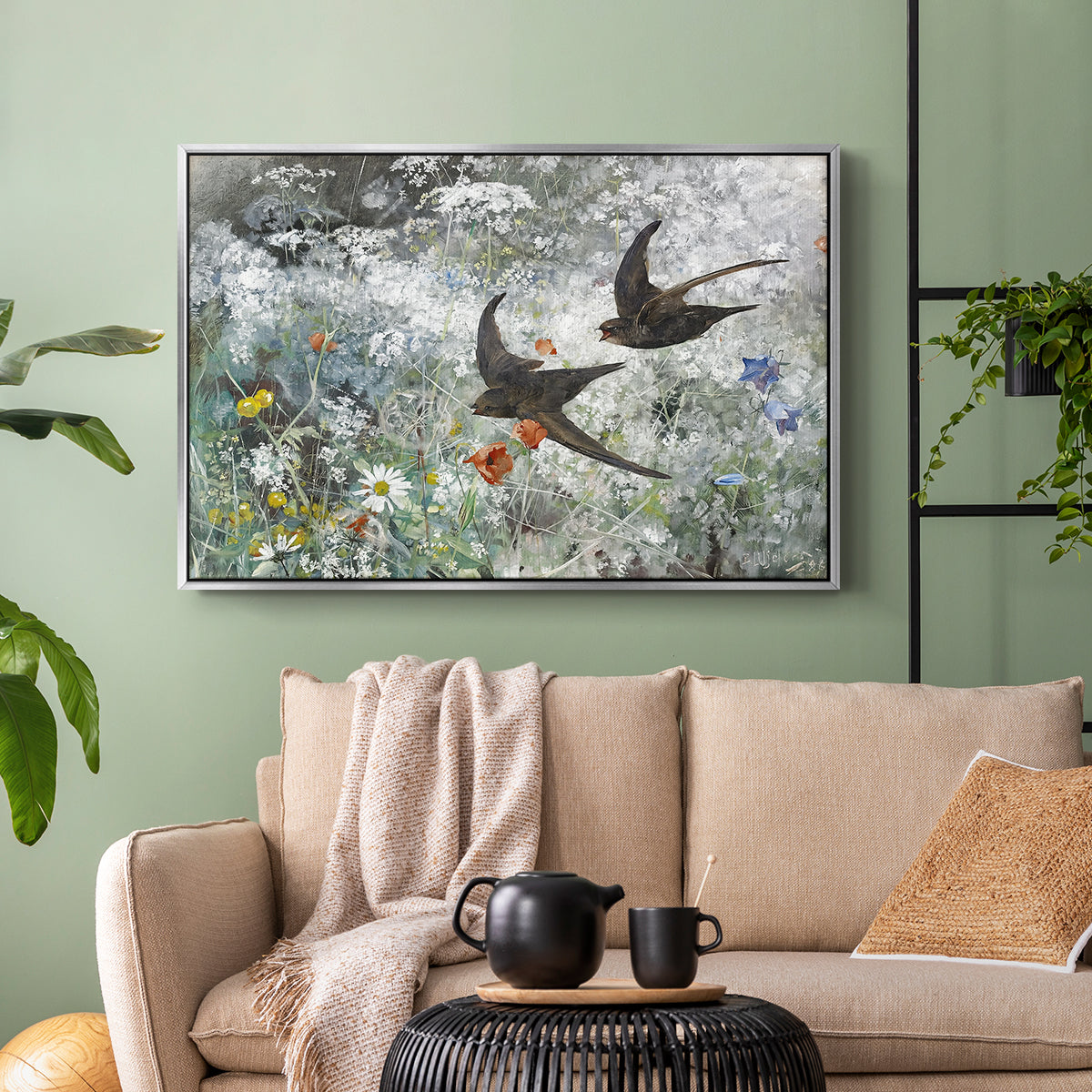 Silver floater framed canvas featuring an impressionist wildlife scene capturing birds in motion, displayed above a sofa in a modern living room.