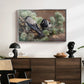 Hooded Crows (Kråkor), 1891 by Bruno Liljefors displayed in a silver floater framed canvas above a dark wood credenza in an entryway.