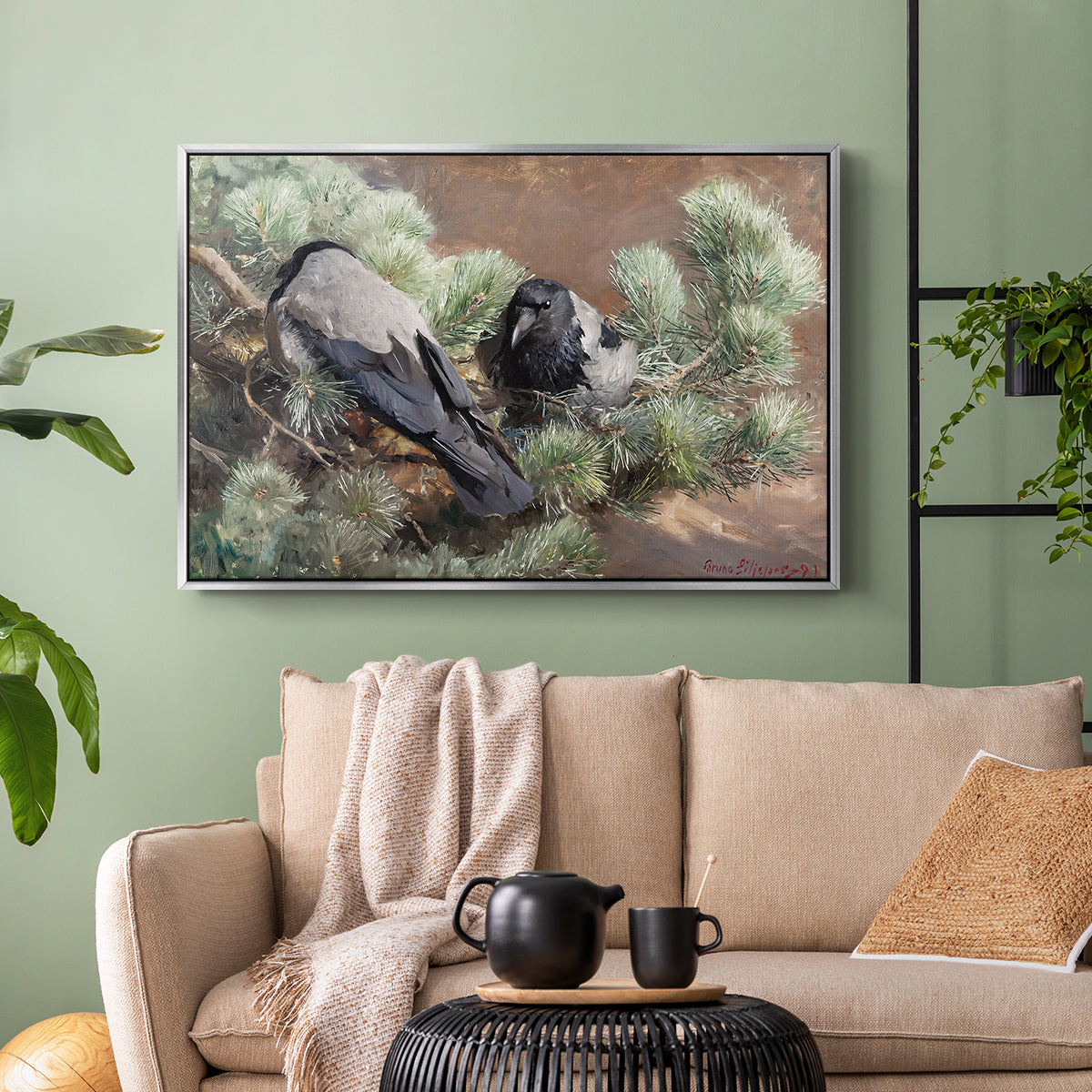 Silver floater framed canvas featuring a wildlife painting of dark birds against muted landscape, displayed above a sofa in a modern living room.
