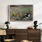 Cat on a Flowery Meadow, 1887 by Bruno Liljefors displayed in a silver floater framed canvas above a dark wood credenza in an entryway.