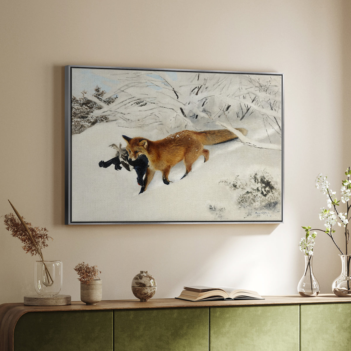 Silver floater framed canvas of Fox in Snow Landscape, 1900 by Bruno Liljefors, featuring a wildlife scene of fox moving swiftly through winter terrain above a sideboard in a softly lit hallway.