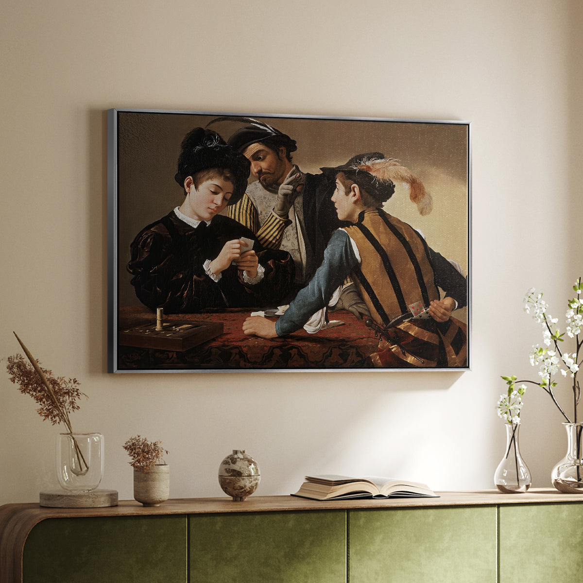 Silver floater framed canvas of The Cardsharps, c. 1594 by Caravaggio, featuring a genre scene of card game with deception and hidden accomplice above a sideboard in a softly lit hallway.