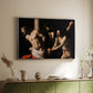 Silver floater framed canvas of The Flagellation of Christ at the Column (Rouen Version), 1606 by Caravaggio, featuring a dramatic religious scene of Christ enduring flagellation in dark interior above a sideboard in a softly lit hallway.