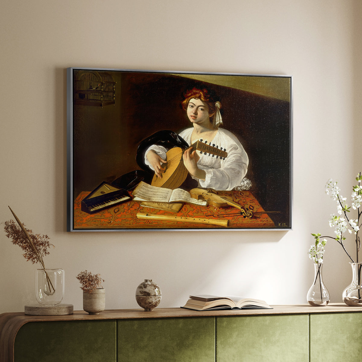Silver floater framed canvas of The Lute Player (Wildenstein Version), c. 1596 by Caravaggio, featuring a musician seated with lute and musical instruments on table above a sideboard in a softly lit hallway.