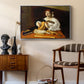 The Lute Player (Wildenstein Version), c. 1596 by Caravaggio as a silver floater framed canvas featuring a detailed scene of youth playing string instrument with fruit and flowers nearby, styled above a mid-century console in a contemporary living area.