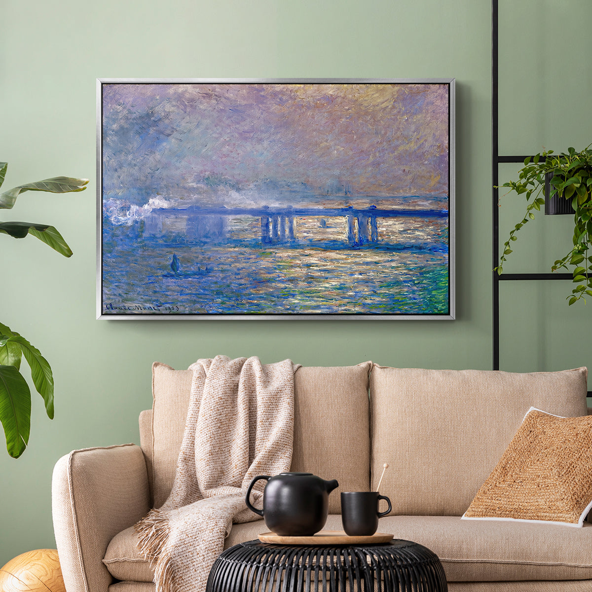 Silver floater framed canvas featuring a city bridge scene softened by mist and impressionist brushwork, displayed above a sofa in a modern living room.