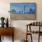 Poppy Field (Giverny), 1890-1891 by Claude Monet as a silver floater framed canvas featuring a vibrant meadow scene with flowers and vertical tree forms, styled above a mid-century console in a contemporary living area.