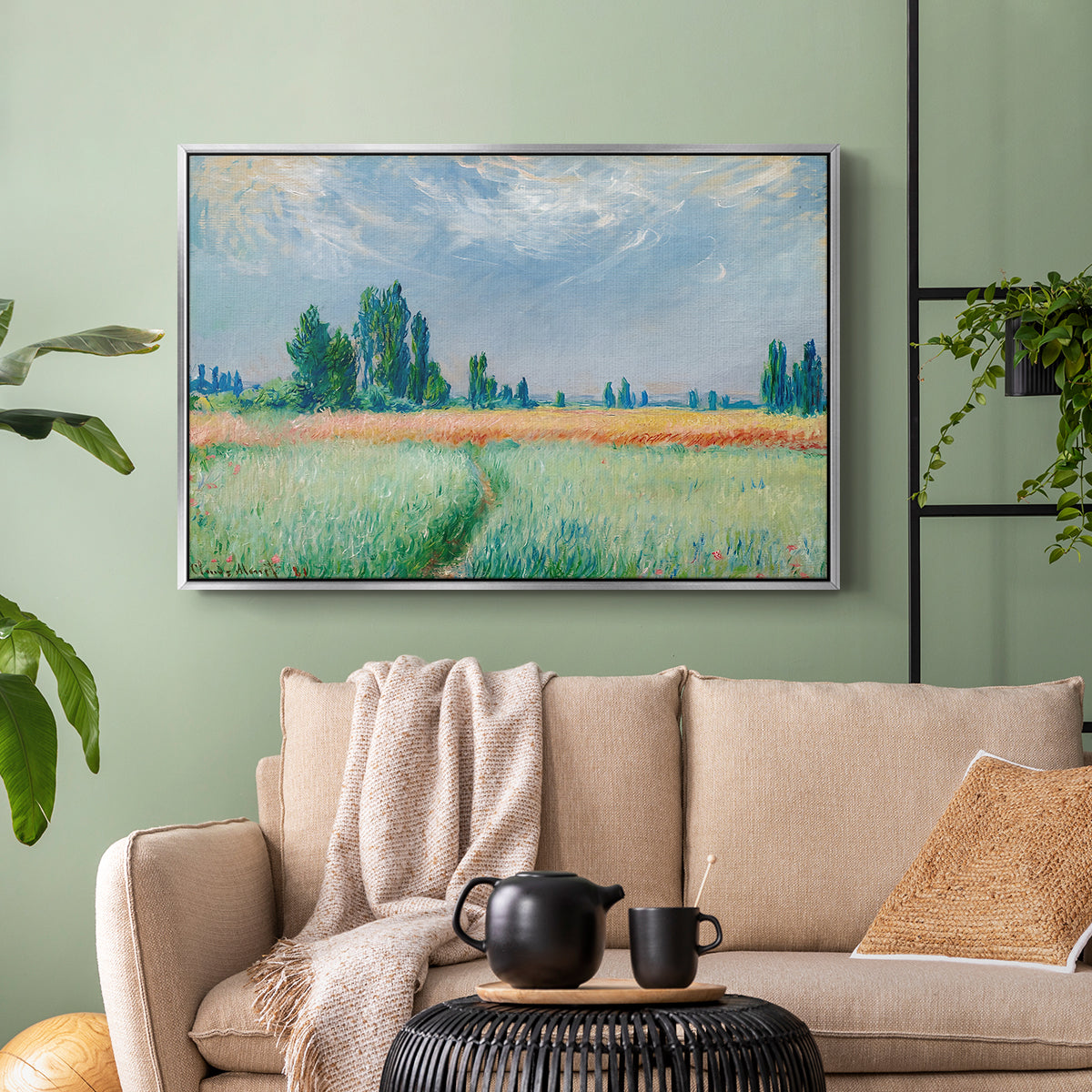 Silver floater framed canvas featuring a serene rural scene with textured wheat under natural light, displayed above a sofa in a modern living room.