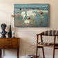 A Holiday, c. 1915 by Edward Henry Potthast as a silver floater framed canvas featuring an impressionist coastal view of families enjoying seaside water, styled above a mid-century console in a contemporary living area.