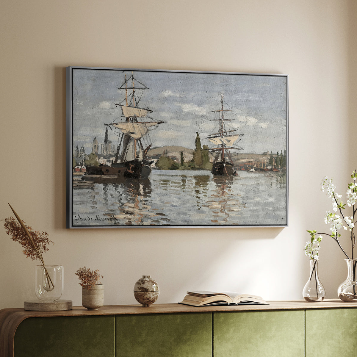 Silver floater framed canvas of Ships Riding on the Seine at Rouen, 1872 by Claude Monet, featuring an impressionist river scene with anchored sailing ships and reflections above a sideboard in a softly lit hallway.