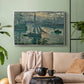 Silver floater framed canvas featuring an atmospheric ocean view with sun rising through haze, displayed above a sofa in a modern living room.