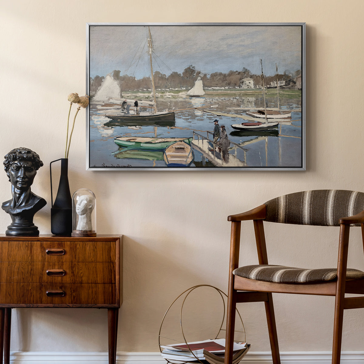 The Basin at Argenteuil, 1874 by Claude Monet as a silver floater framed canvas featuring a harbor basin filled with boats under soft sky, styled above a mid-century console in a contemporary living area.