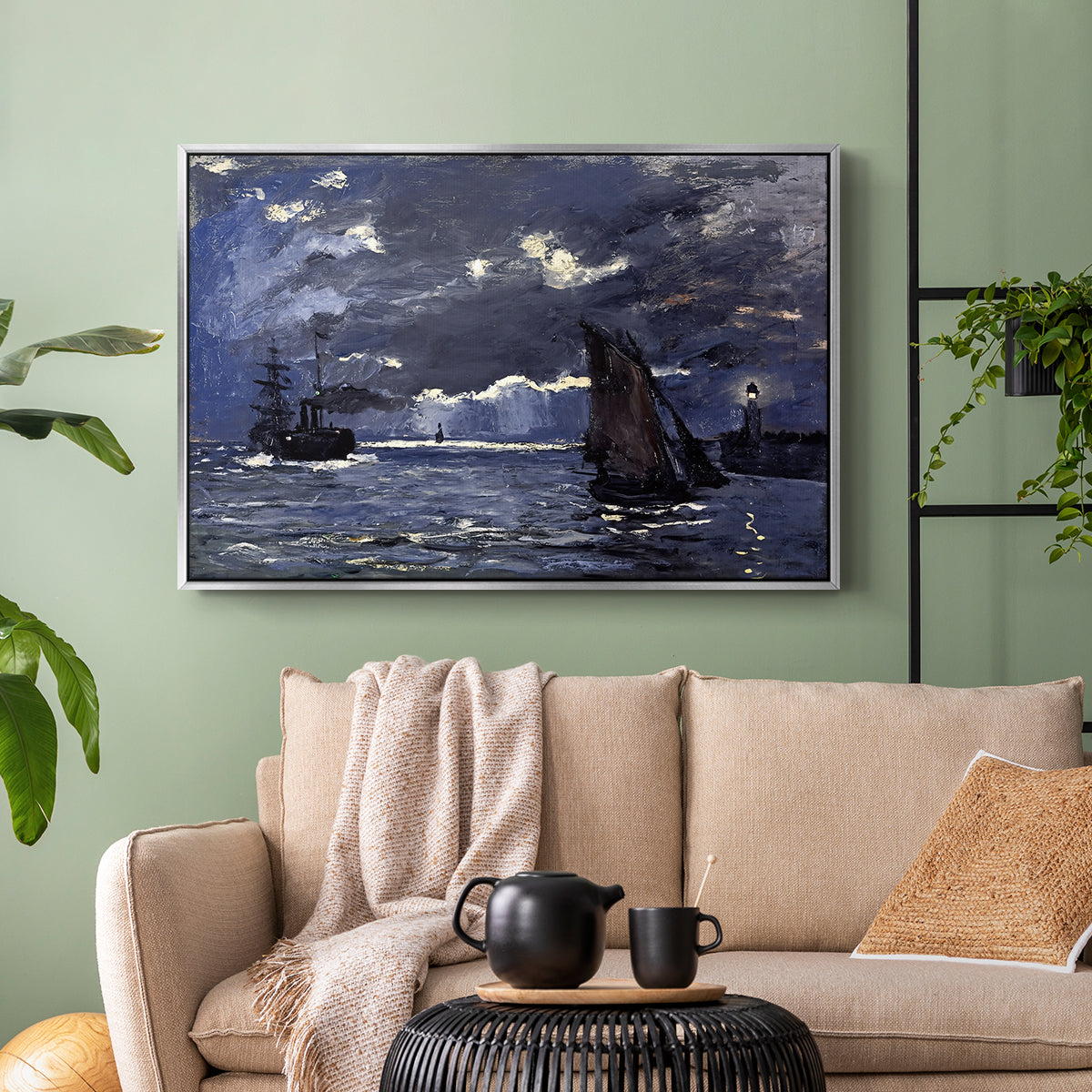 Silver floater framed canvas featuring an atmospheric maritime view with ships in moonlit darkness, displayed above a sofa in a modern living room.