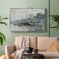 Silver floater framed canvas featuring a harbor view with masts, houses, and reflections in water, displayed above a sofa in a modern living room.