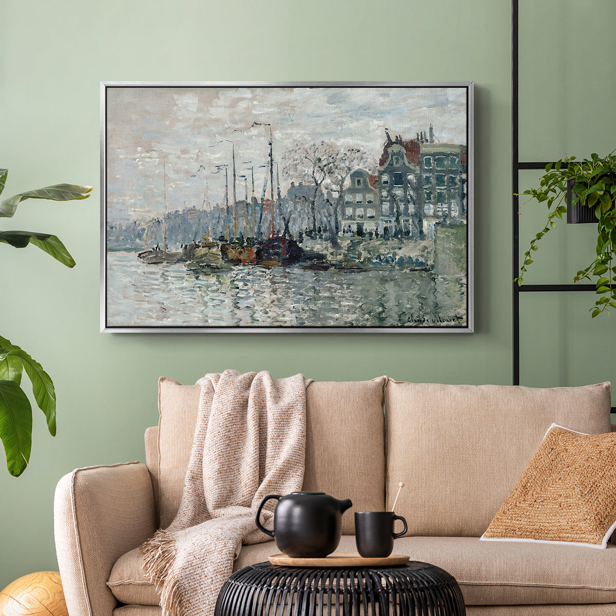 Silver floater framed canvas featuring a harbor view with masts, houses, and reflections in water, displayed above a sofa in a modern living room.