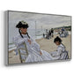 Angled view of On the Beach at Trouville, 1870 by Claude Monet in a silver floater framed canvas.