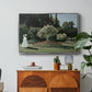 Woman in the Garden, Sainte-Adresse, 1867 by Claude Monet in a silver floater framed canvas featuring a woman standing in garden surrounded by flowers and greenery, displayed above a wood console cabinet.