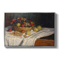 Still Life with Apples and Grapes, 1880 by Claude Monet in a silver floater framed canvas wall art display.