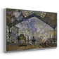 Angled view of The Gare Saint-Lazare, 1877 by Claude Monet in a silver floater framed canvas.