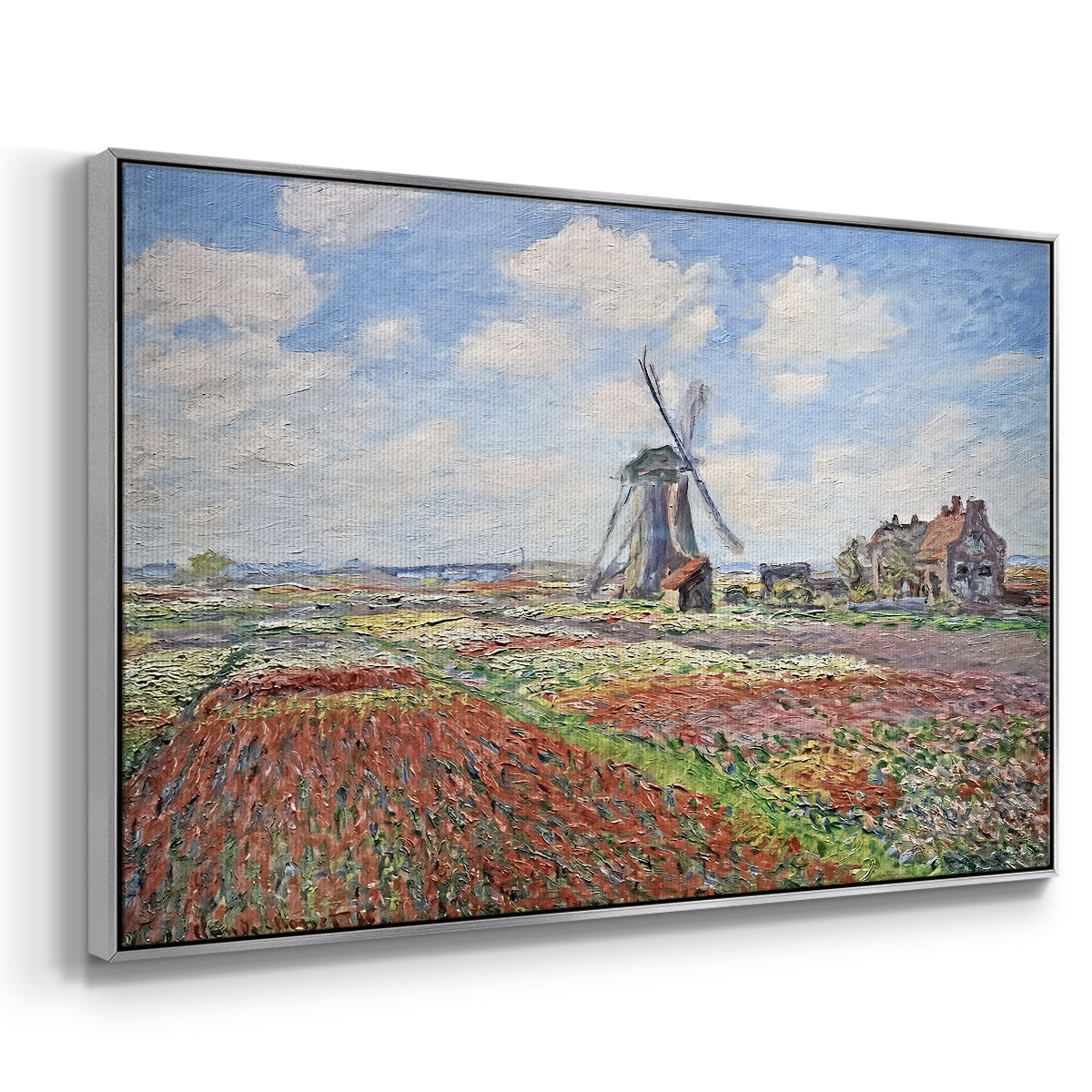 Angled view of Tulip Fields with the Rijnsburg Windmill, 1886 by Claude Monet in a silver floater framed canvas.