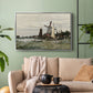 Silver floater framed canvas featuring a countryside structure standing against open sky, displayed above a sofa in a modern living room.