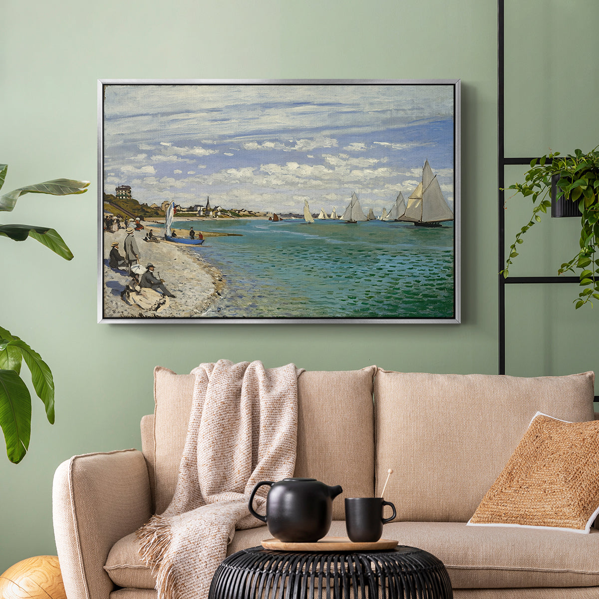 Silver floater framed canvas featuring a nautical scene with boats racing near seaside town, displayed above a sofa in a modern living room.