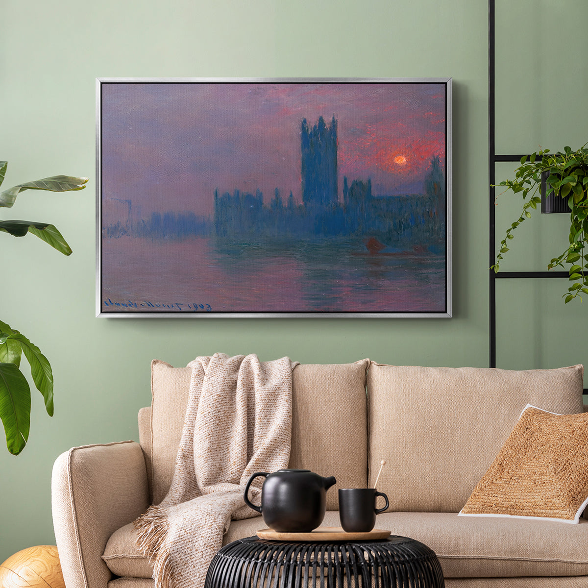 Silver floater framed canvas featuring a dramatic skyline with reflections under colorful sky, displayed above a sofa in a modern living room.