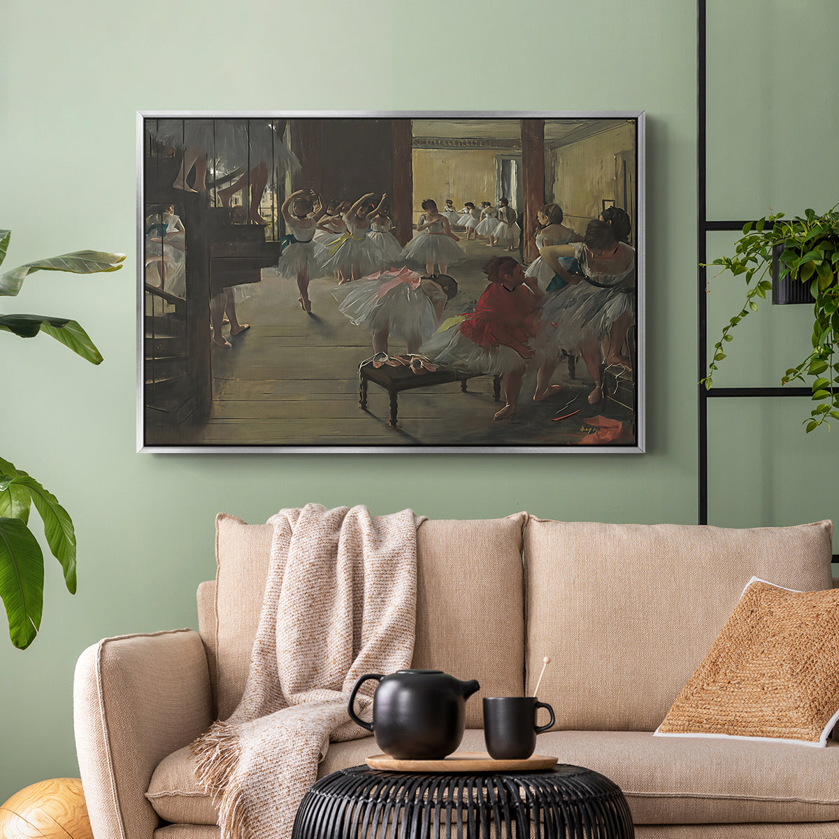 Silver floater framed canvas featuring a group of dancers preparing during class with natural light, displayed above a sofa in a modern living room.