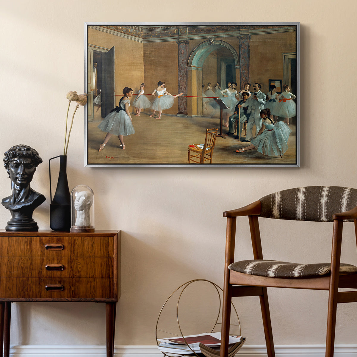 The Dance Foyer at the Opera on the Rue Le Peletier, 1872 by Edgar Degas as a silver floater framed canvas featuring an impressionist depiction of ballet foyer with multiple figures, styled above a mid-century console in a contemporary living area.