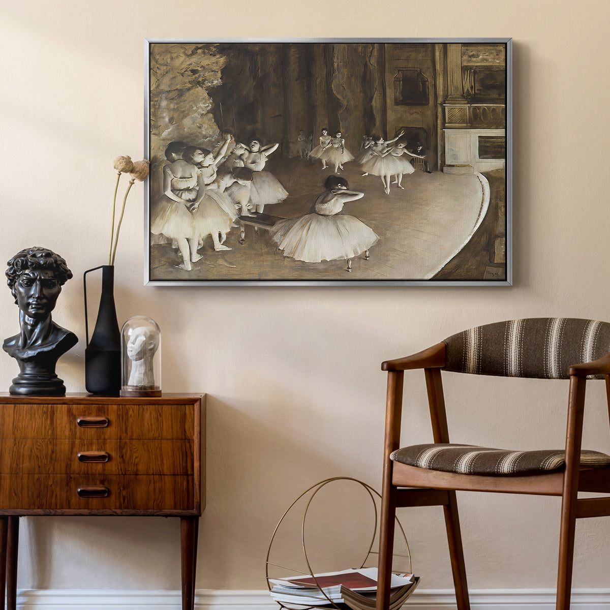 The Rehearsal of the Ballet Onstage, 1874 by Edgar Degas as a silver floater framed canvas featuring an impressionist depiction of ballet practice on theater stage, styled above a mid-century console in a contemporary living area.