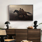 A Ride for Liberty – The Fugitive Slaves, c. 1862 by Eastman Johnson displayed in a silver floater framed canvas above a dark wood credenza in an entryway.