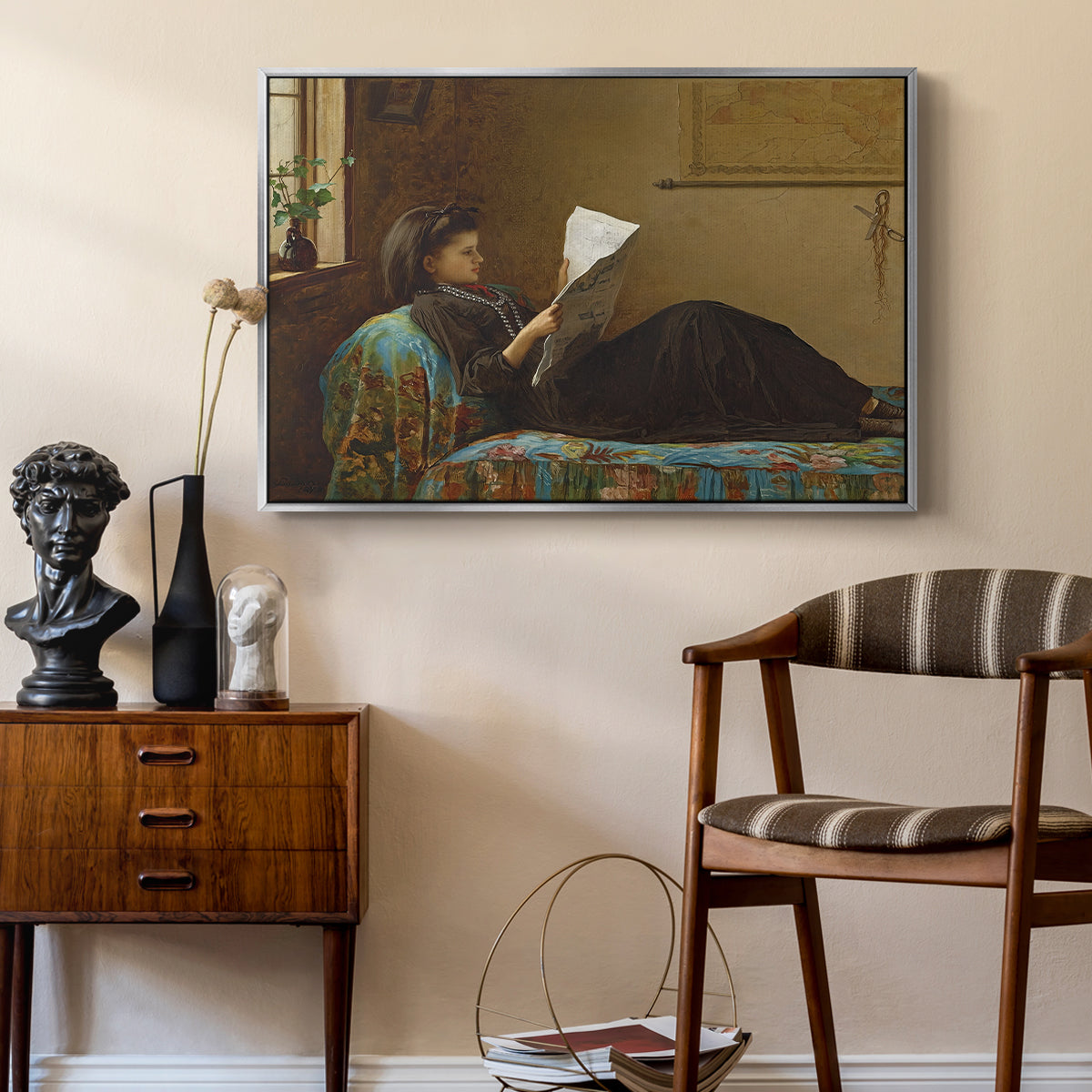 Interesting News, 1872 by Eastman Johnson as a silver floater framed canvas featuring an Americana interior with people focused on printed page, styled above a mid-century console in a contemporary living area.