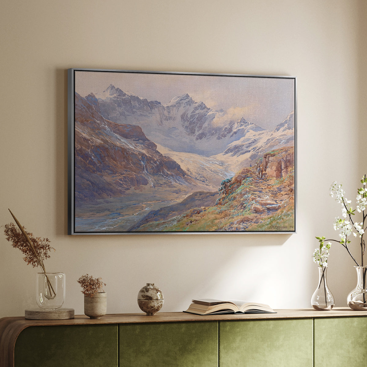 Silver floater framed canvas of Odenwinklkees with the Johannisberg, 1902 by Edward Theodore Compton, featuring a mountain scene with glacier stretching through rocky valley above a sideboard in a softly lit hallway.