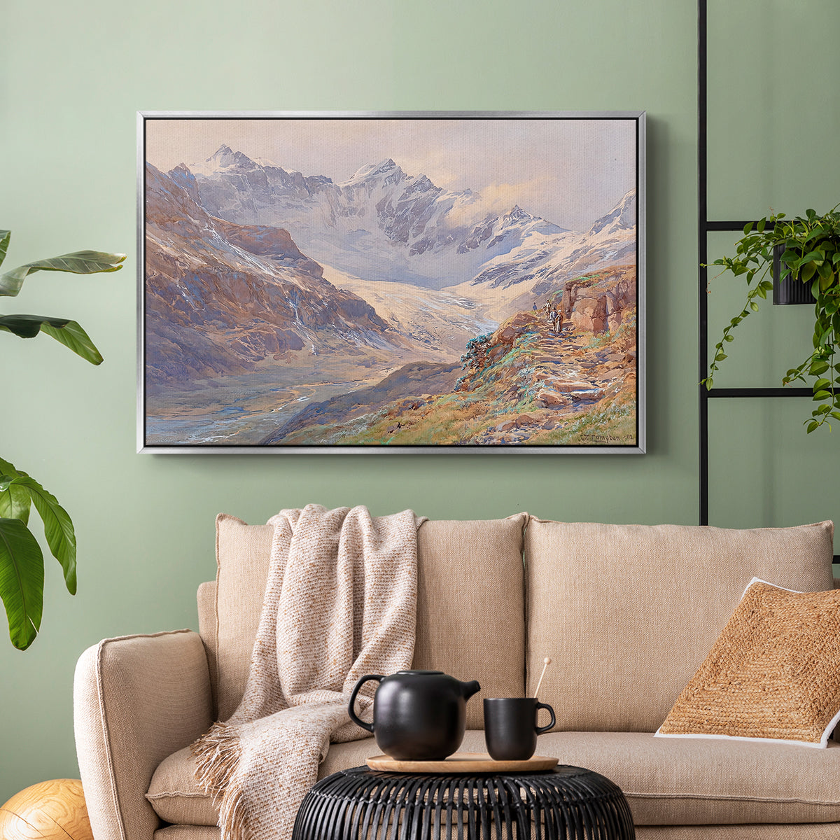 Silver floater framed canvas featuring an expansive alpine view with ice and distant mountains, displayed above a sofa in a modern living room.