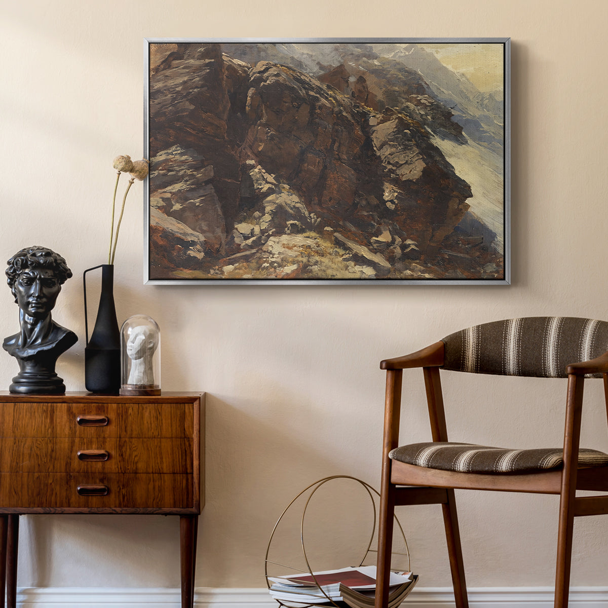 High Mountain Study, c. 1870 by Edward Theodore Compton as a silver floater framed canvas featuring a high-altitude scene with rocky formations and sparse vegetation, styled above a mid-century console in a contemporary living area.