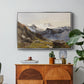 The Großglockner from the Prager Hut, 1890 by Edward Theodore Compton in a silver floater framed canvas featuring a view of Großglockner peak from alpine hut overlooking valley, displayed above a wood console cabinet.