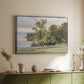 Silver floater framed canvas of Landscape at Lake Starnberg, 1890 by Edward Theodore Compton, featuring a peaceful lake scene with reflections and surrounding greenery above a sideboard in a softly lit hallway.
