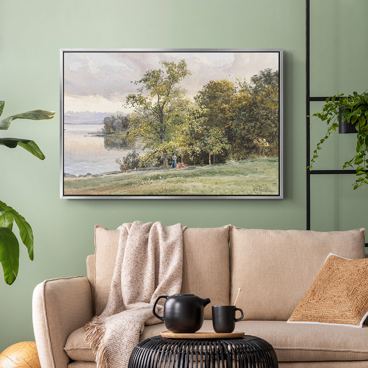 Silver floater framed canvas featuring a tranquil lakeside view with soft atmospheric tones, displayed above a sofa in a modern living room.