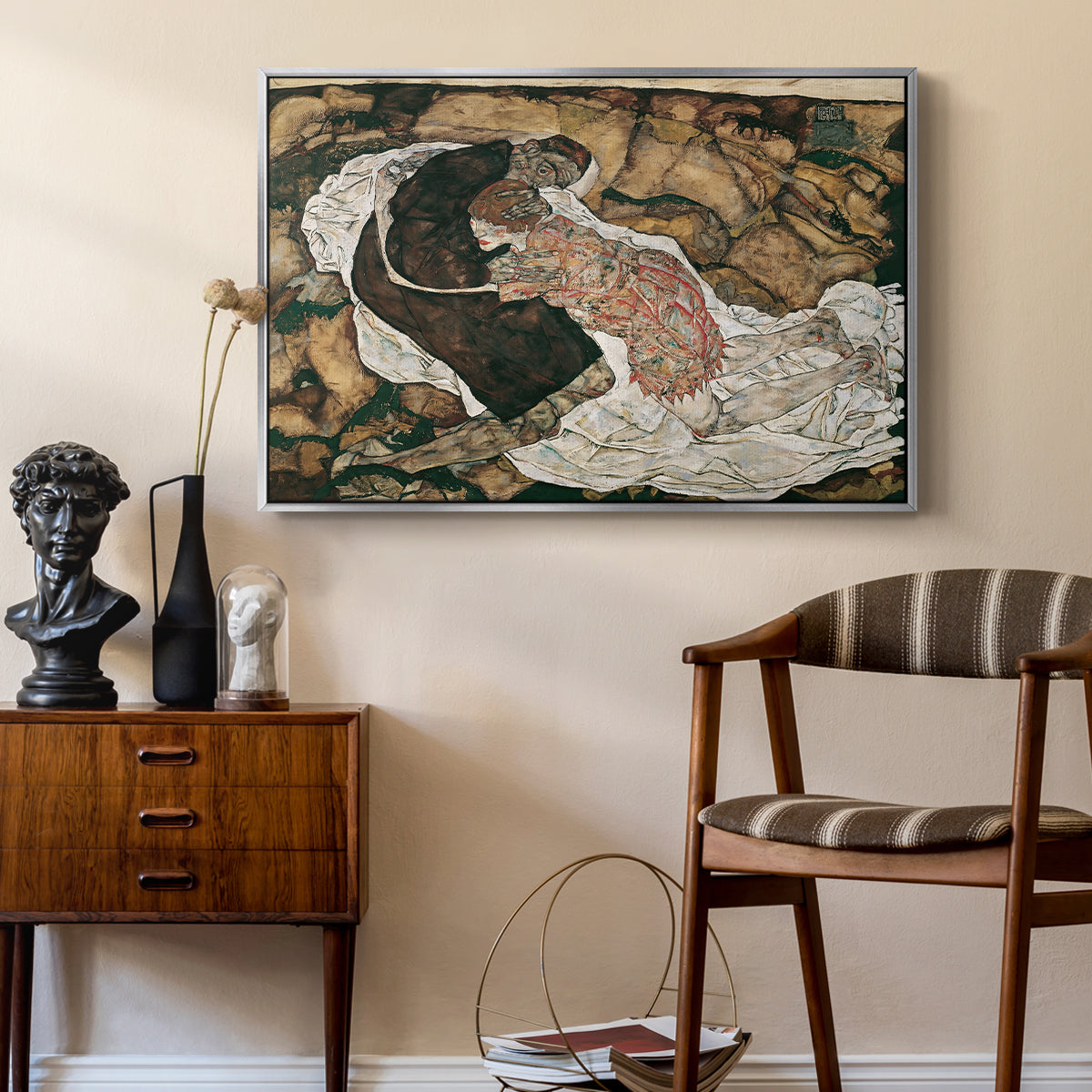 Death and the Maiden, 1915 by Egon Schiele as a silver floater framed canvas featuring an expressionist painting of human figures in dramatic pose, styled above a mid-century console in a contemporary living area.