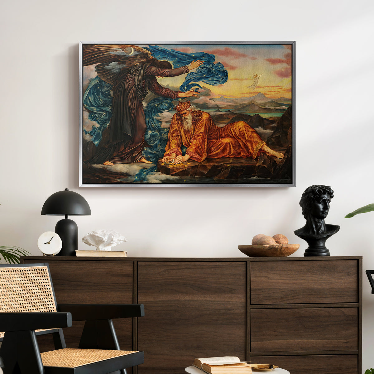 Earthbound, 1897 by Evelyn De Morgan displayed in a silver floater framed canvas above a dark wood credenza in an entryway.