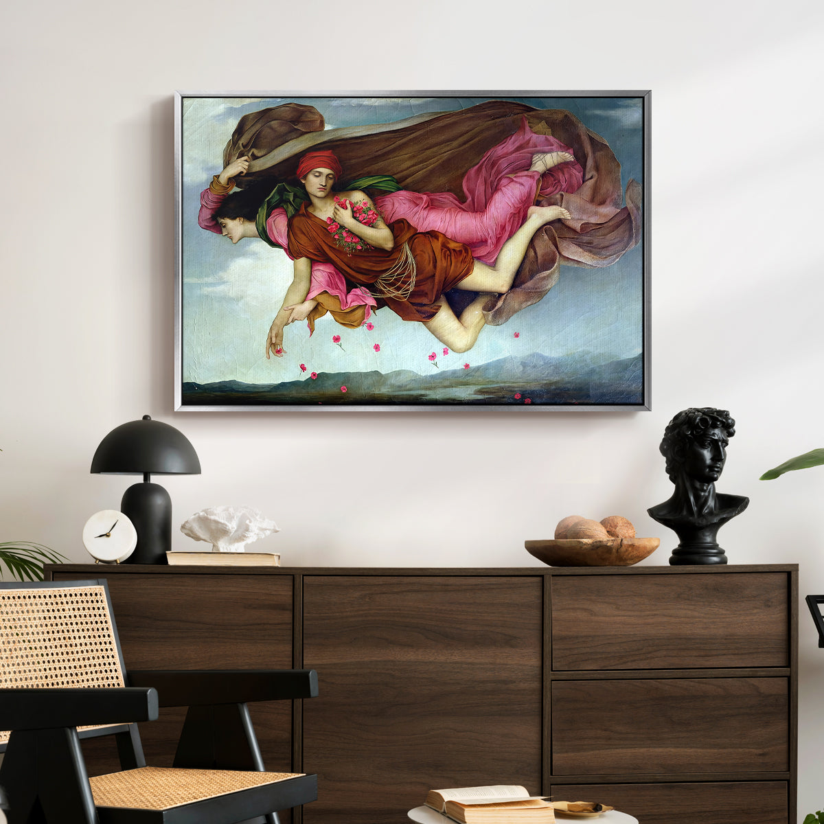 Night and Sleep, 1878 by Evelyn De Morgan displayed in a silver floater framed canvas above a dark wood credenza in an entryway.