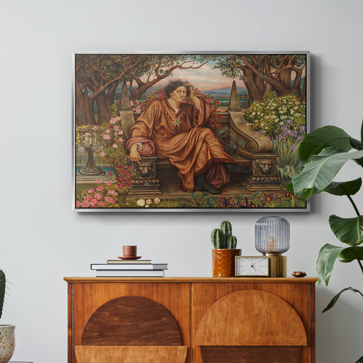 A Soul in Hell, c. 1901-1902 by Evelyn De Morgan in a silver floater framed canvas featuring a distressed figure surrounded by flames and torment in symbolic hell scene, displayed above a wood console cabinet.