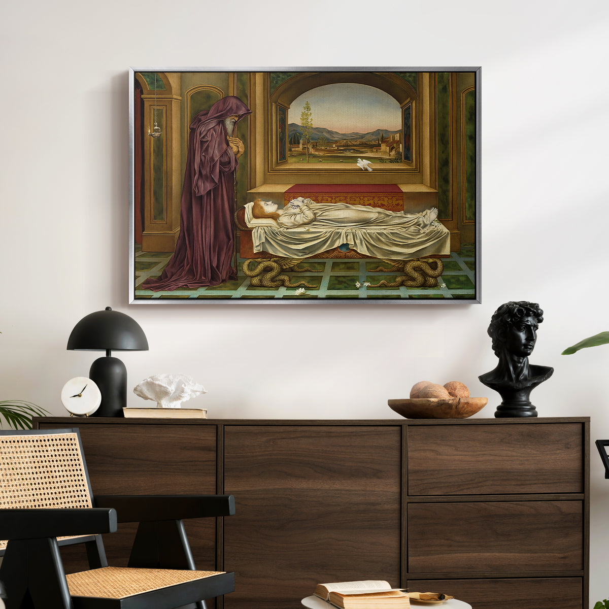 The Wandering Jew: Whom the Gods Love Die Young, 1888 by Evelyn De Morgan displayed in a silver floater framed canvas above a dark wood credenza in an entryway.