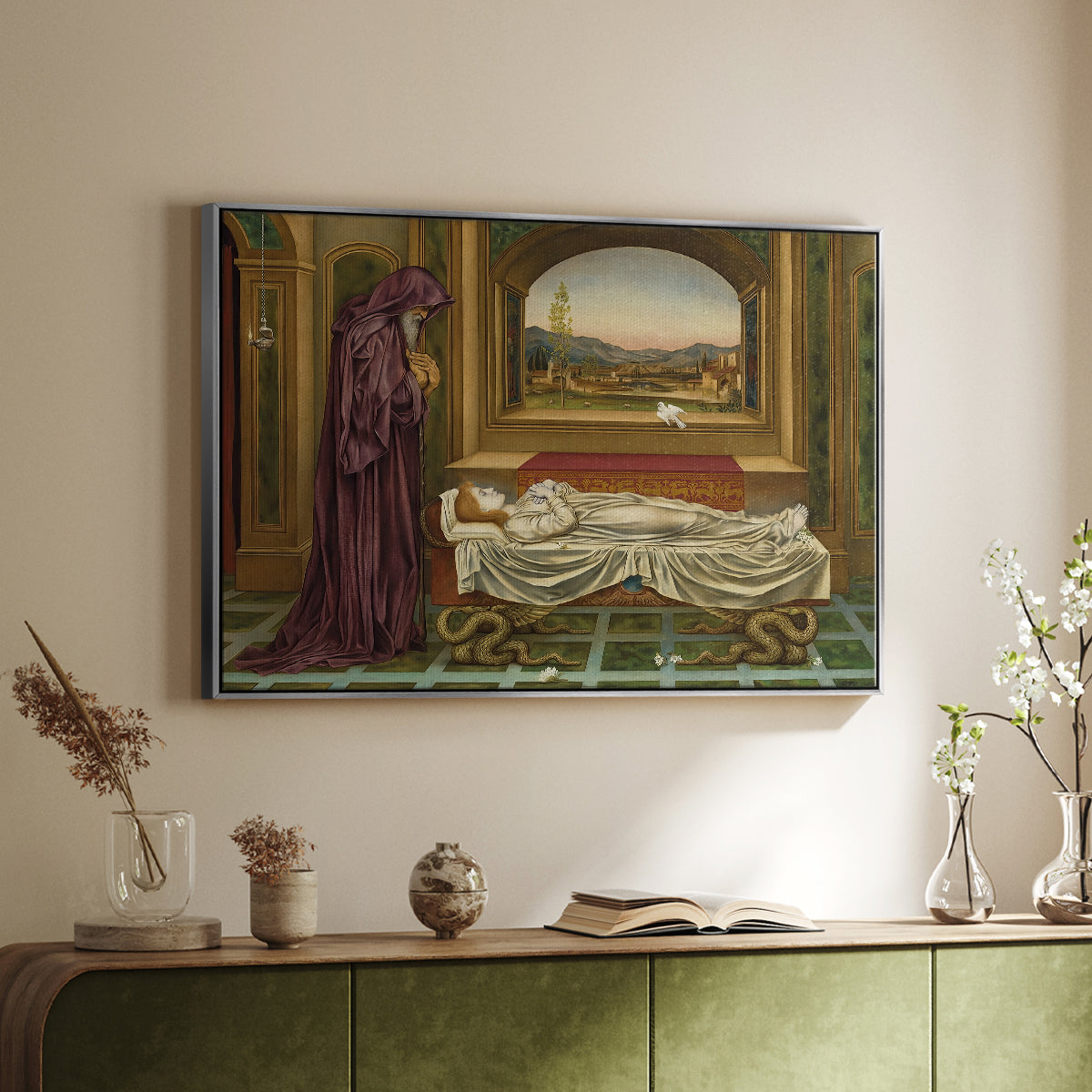 Silver floater framed canvas of The Wandering Jew: Whom the Gods Love Die Young, 1888 by Evelyn De Morgan, featuring a symbolic portrait of wandering figure in quiet architectural setting above a sideboard in a softly lit hallway.