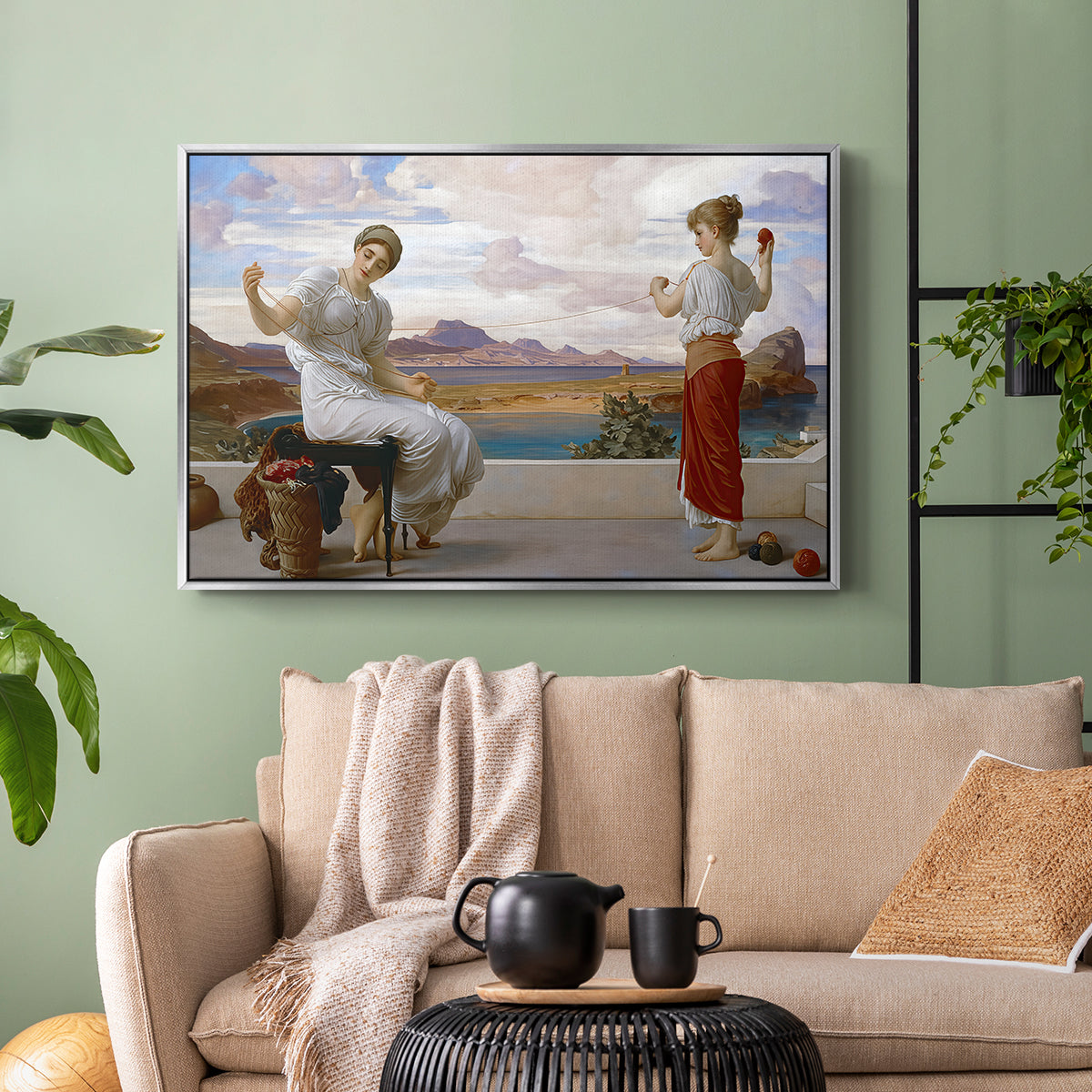 Silver floater framed canvas featuring an elegant composition of women performing domestic task, displayed above a sofa in a modern living room.