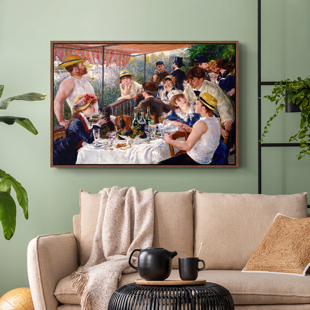 Walnut floater framed canvas featuring a social dining scene with figures seated around table on riverside terrace, displayed above a sofa in a modern living room.