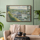 Walnut floater framed canvas featuring an everyday life scene with boat and figures along river edge, displayed above a sofa in a modern living room.