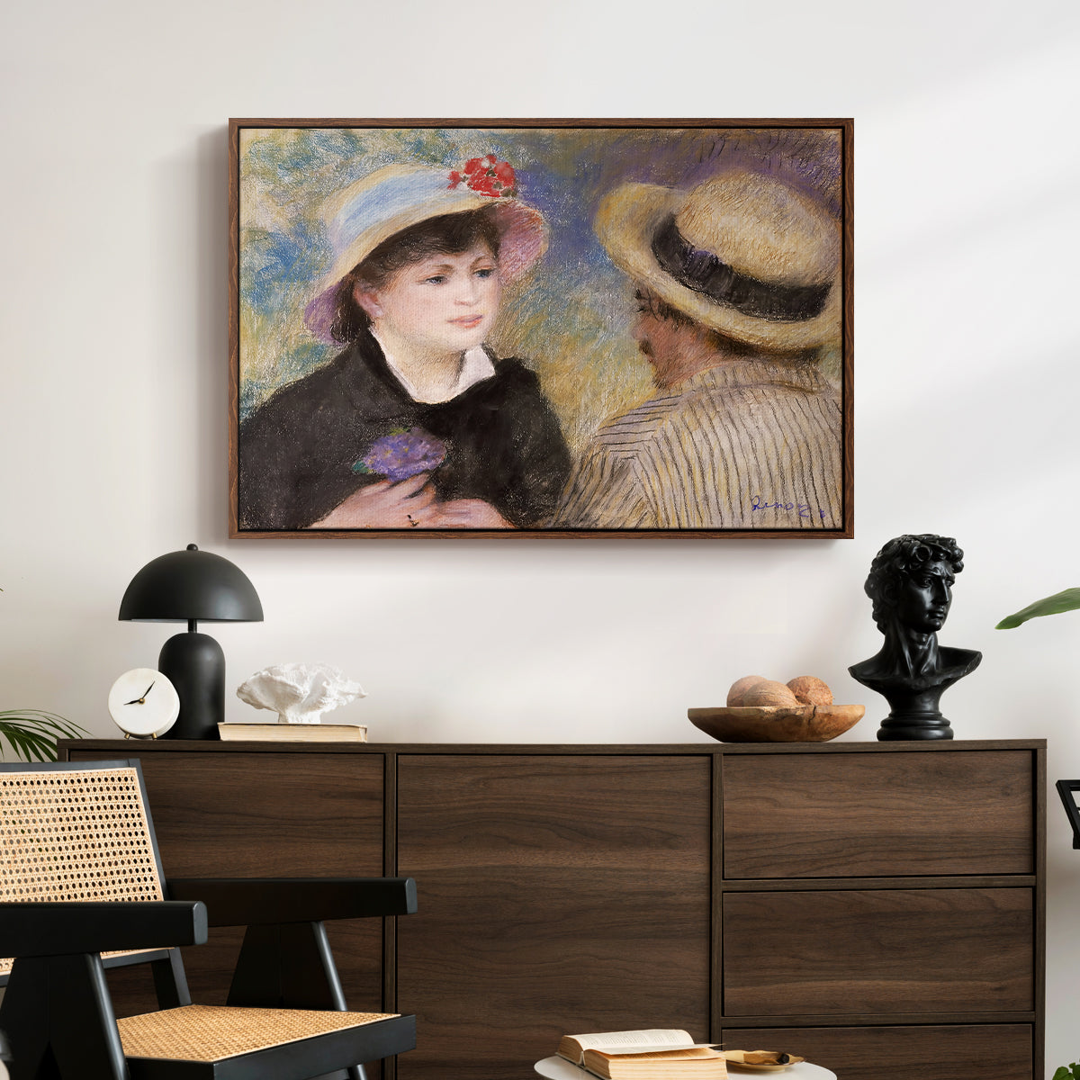 Boating Couple (Aline Charigot and Renoir), c. 1881 by Pierre-Auguste Renoir displayed in a walnut floater framed canvas above a dark wood credenza in an entryway.